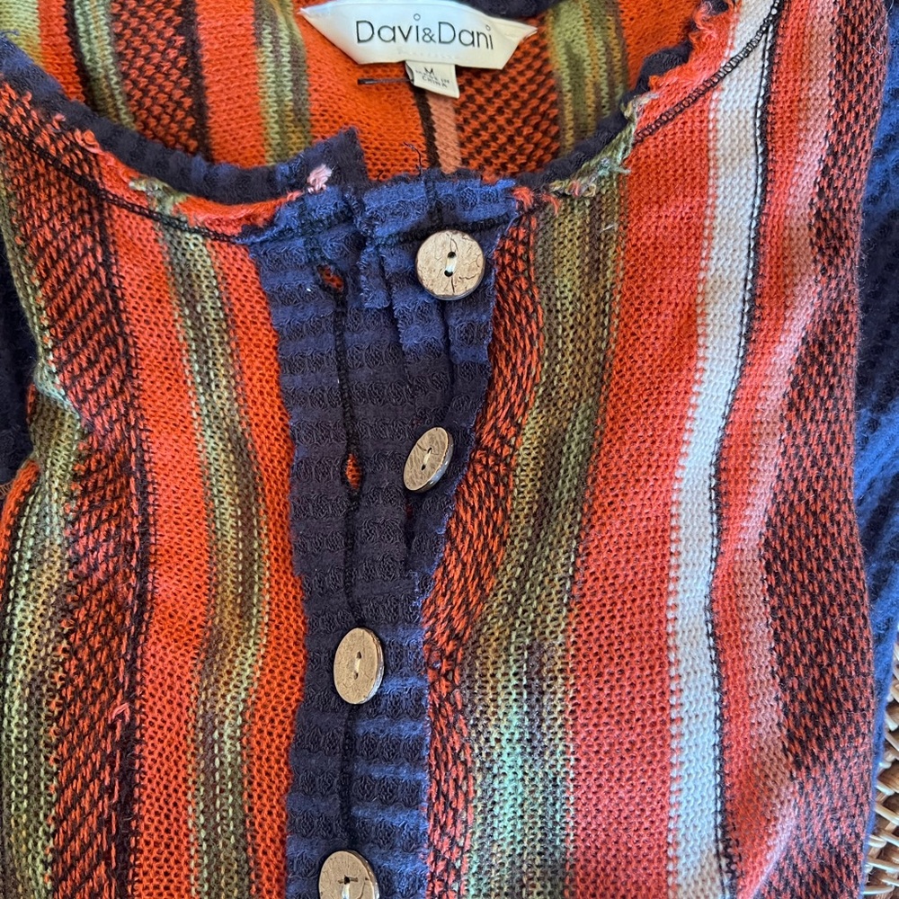 Cute distressed thermal style top with pockets!